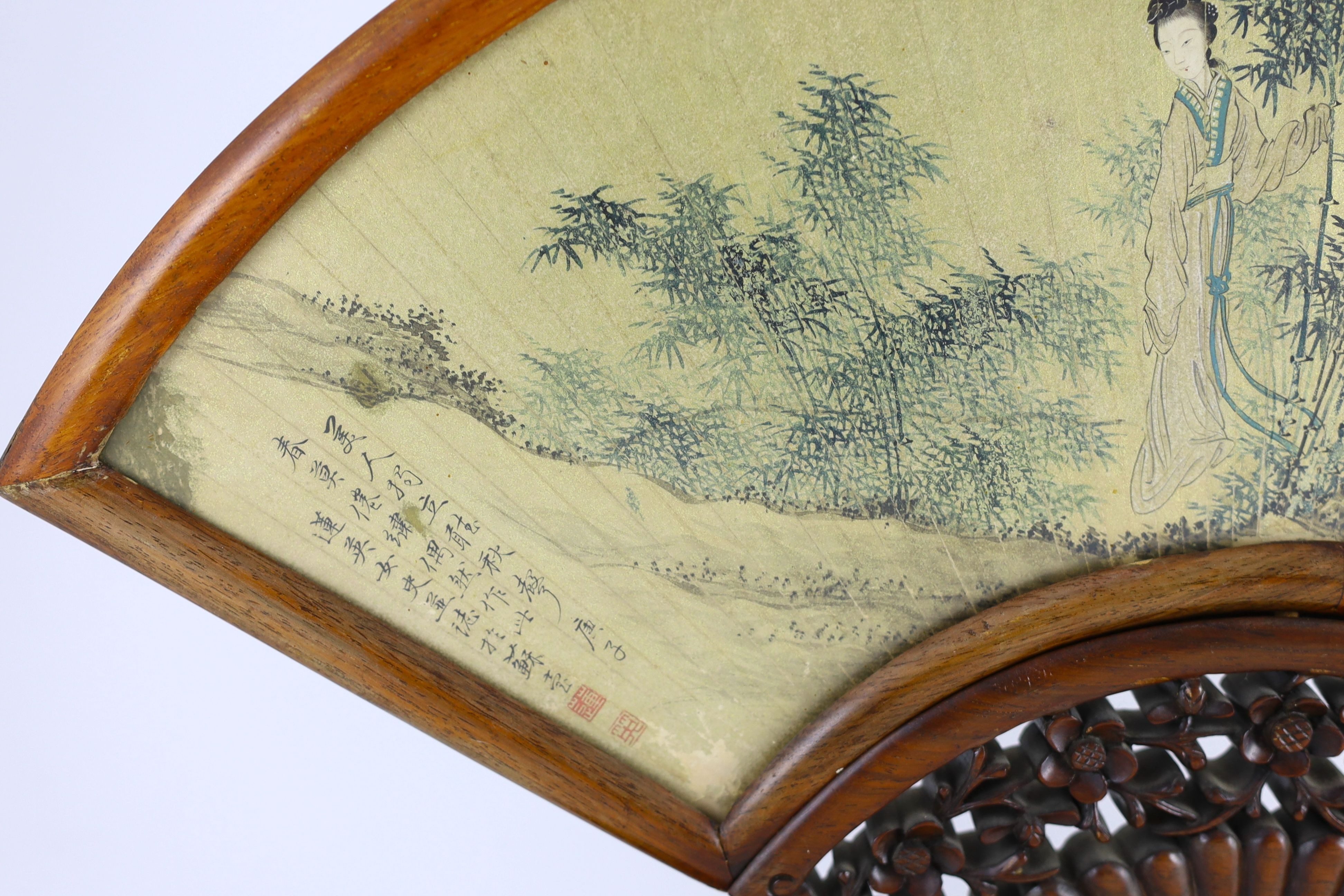 A Chinese painted and inscribed gilt paper fan leaf, 19th century, Total width 56 cm, minor damage